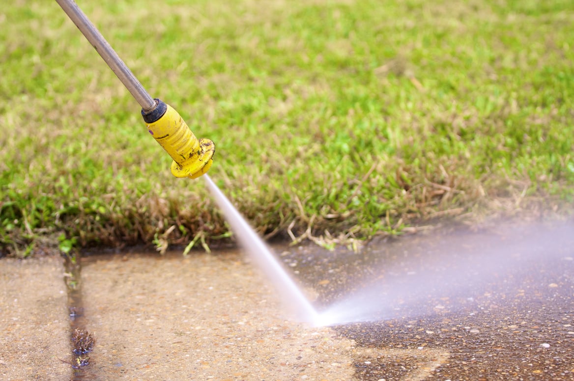 pressure washing a sidewalk